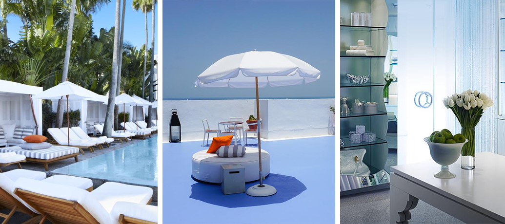 A chic line of poolside cabanas and tall green palm trees are the background to a row of white pool recliners, accented with tall white umbrellas and colorful pillows. An oversized ottoman is kept out of the sun by a tall white umbrella on a rooftop. A spa's cool blue interior is made serene by a bowl of bright green limes and a vase of white tulips.