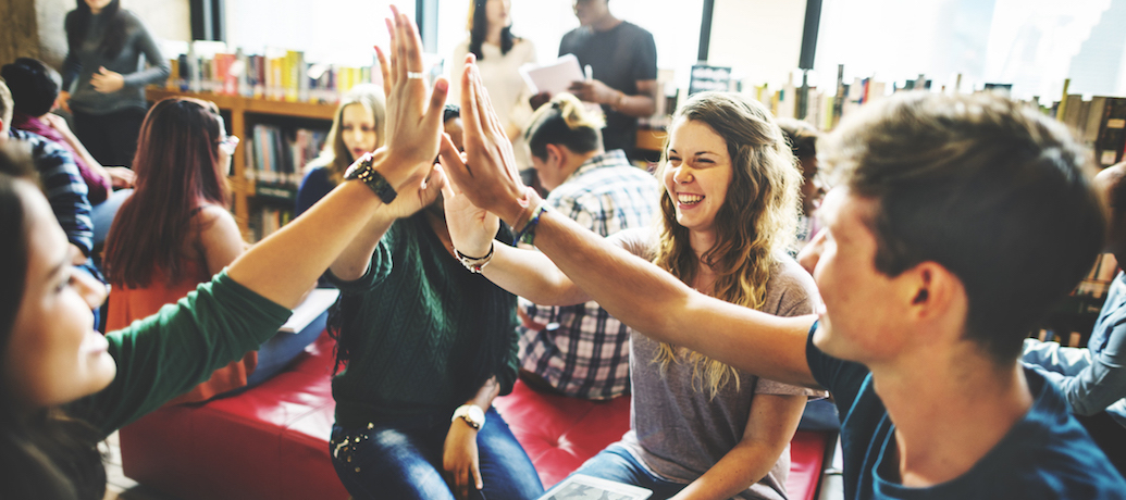 Happy employees celebrating positive work culture