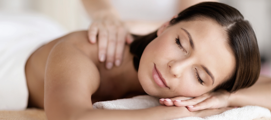 A mom relaxes peacefully during a Zeel in-home Mother’s Day massage