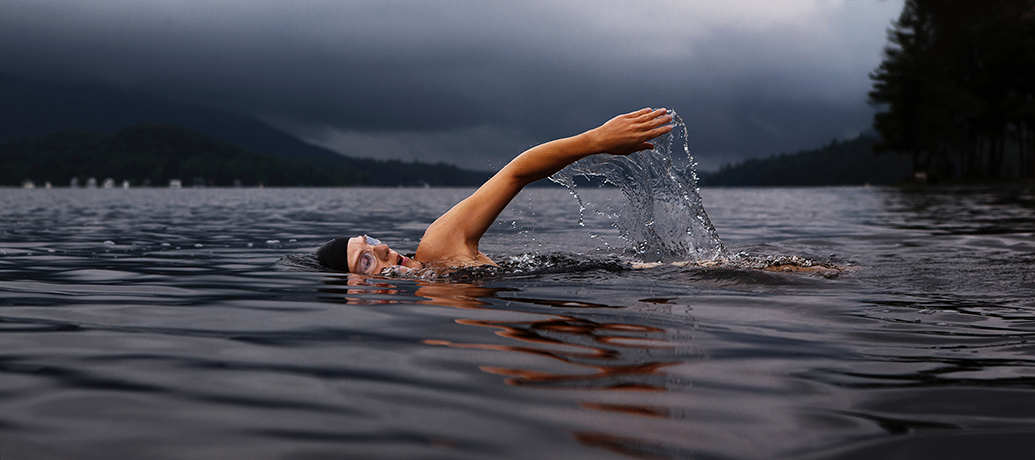 Swimmer works out in a lake