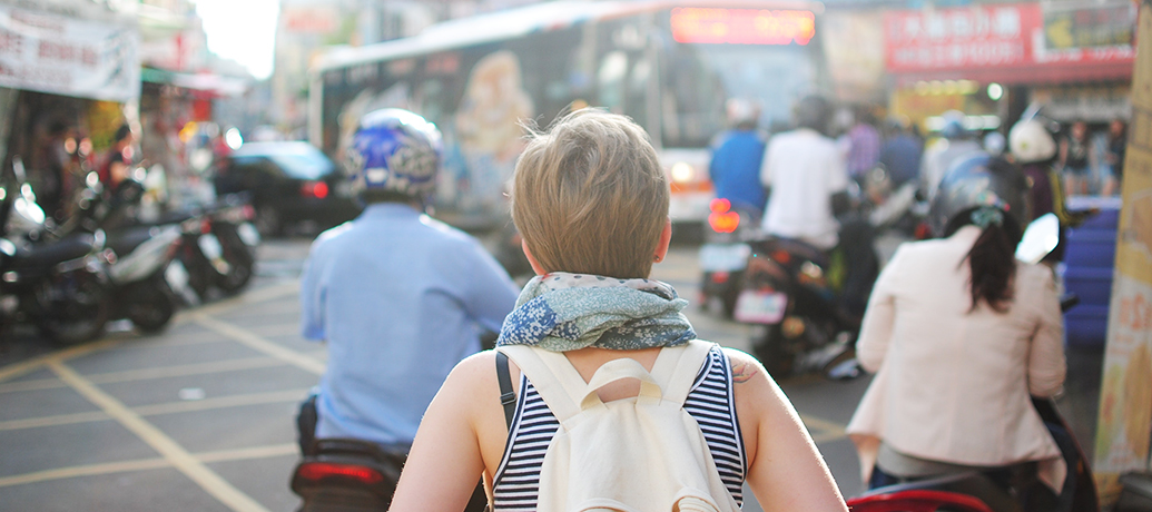 Woman traveling in crowd