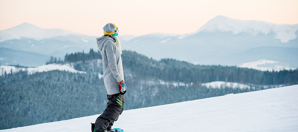 Woman snowboarding in winter