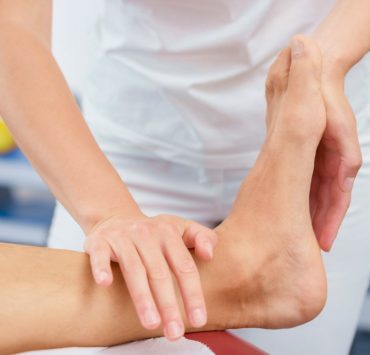 A person getting a deep tissue massage for their plantar fasciitis pain.