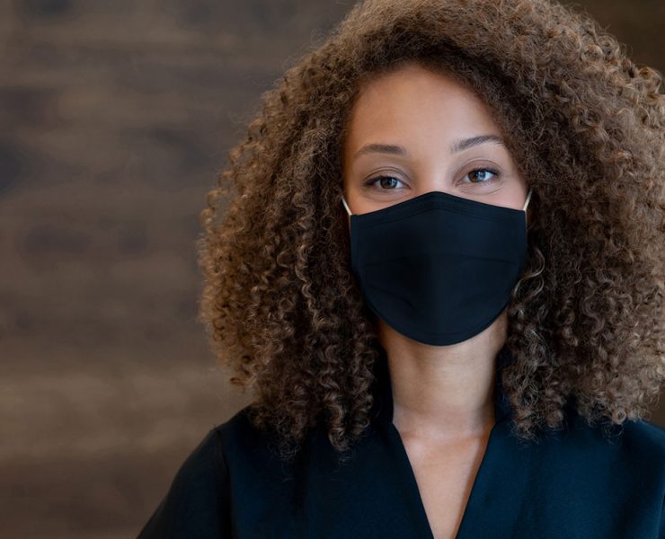 A woman wearing personal protective equipmentduring the COVID-19 pandemic.