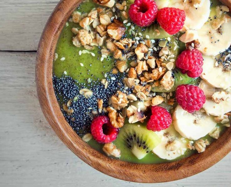 A smoothie bowl filled with various nutrients that are good for muscle recovery.