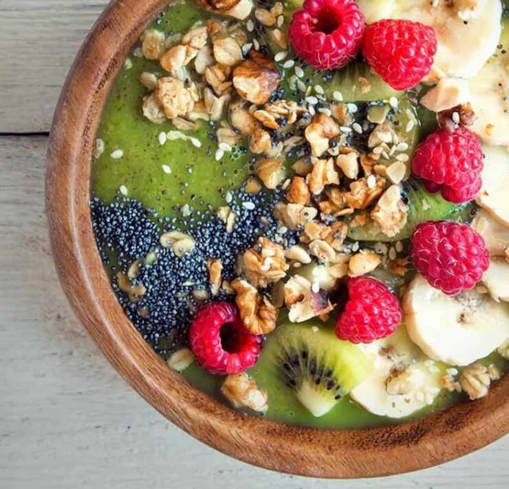 A smoothie bowl filled with various nutrients that are good for muscle recovery.