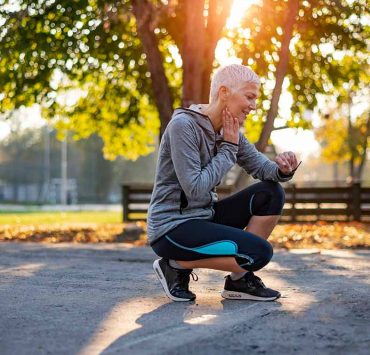 An older woman kneeling down in pain due to her vascular aging.
