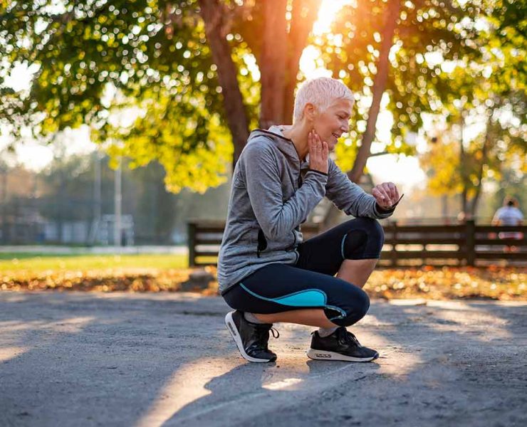 An older woman kneeling down in pain due to her vascular aging.