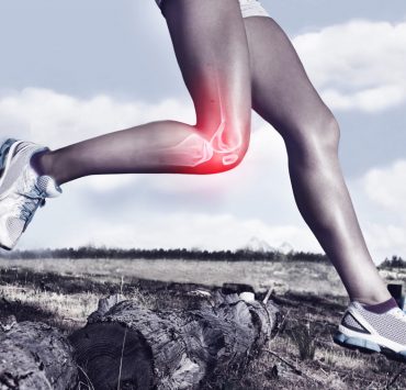 I person running with a red illustration over their knee to signify the pain they're experiencing from runner's knee.