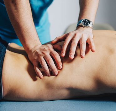 A man receiving a sports massage.