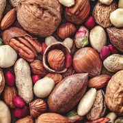 An variety of different nuts pilled together.